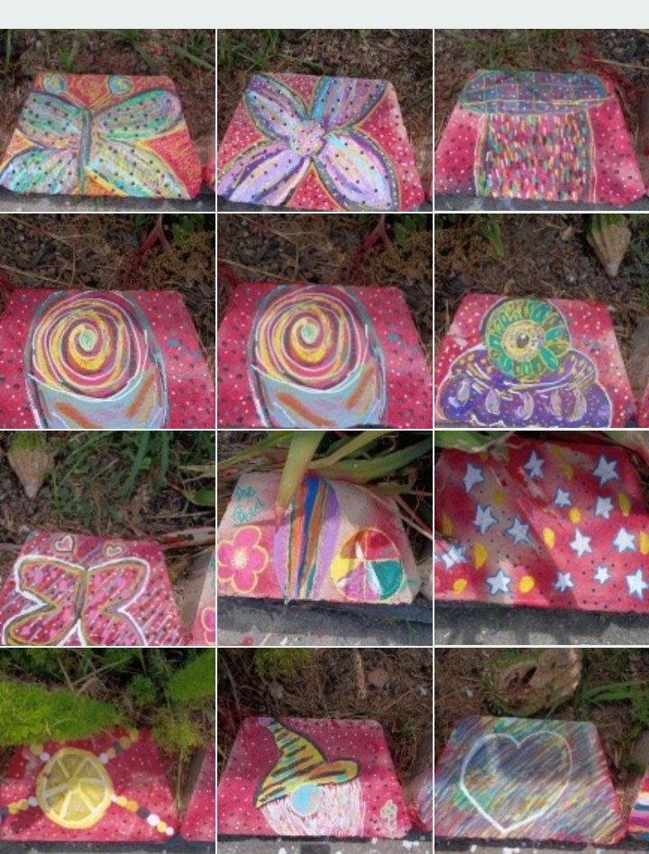 Grid of Mia Roze Bootz's hand-painted garden blocks — butterflies, spirals, stars, a lemon slice, and a heart in bright pink, teal, orange, and rainbow colours