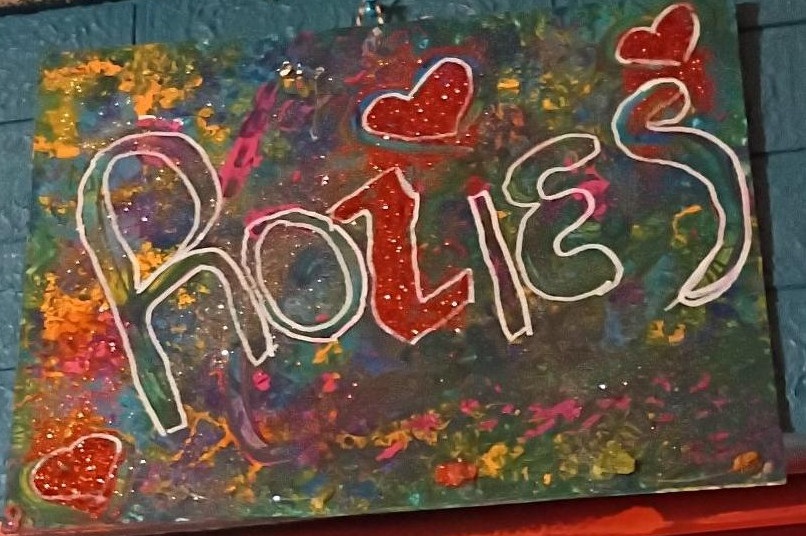 Mia Roze Bootz's hand-painted Rozie's sign